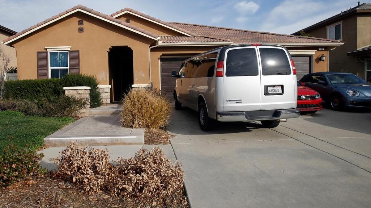 The exterior of the home where police arrested a couple accused of holding their 13 children captive, in Perris, Tuesday, Jan. 16, 2018. Authorities said an emaciated teenager led deputies to the California home where her 12 brothers and sisters were locked up in filthy conditions, with some of them malnourished and chained to beds. (AP Photo/Alex Gallardo)
