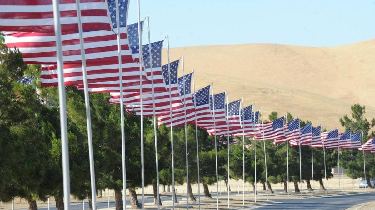 Flags line the entrance to San Joaquin Valley National Cemetery in Santa Nella.