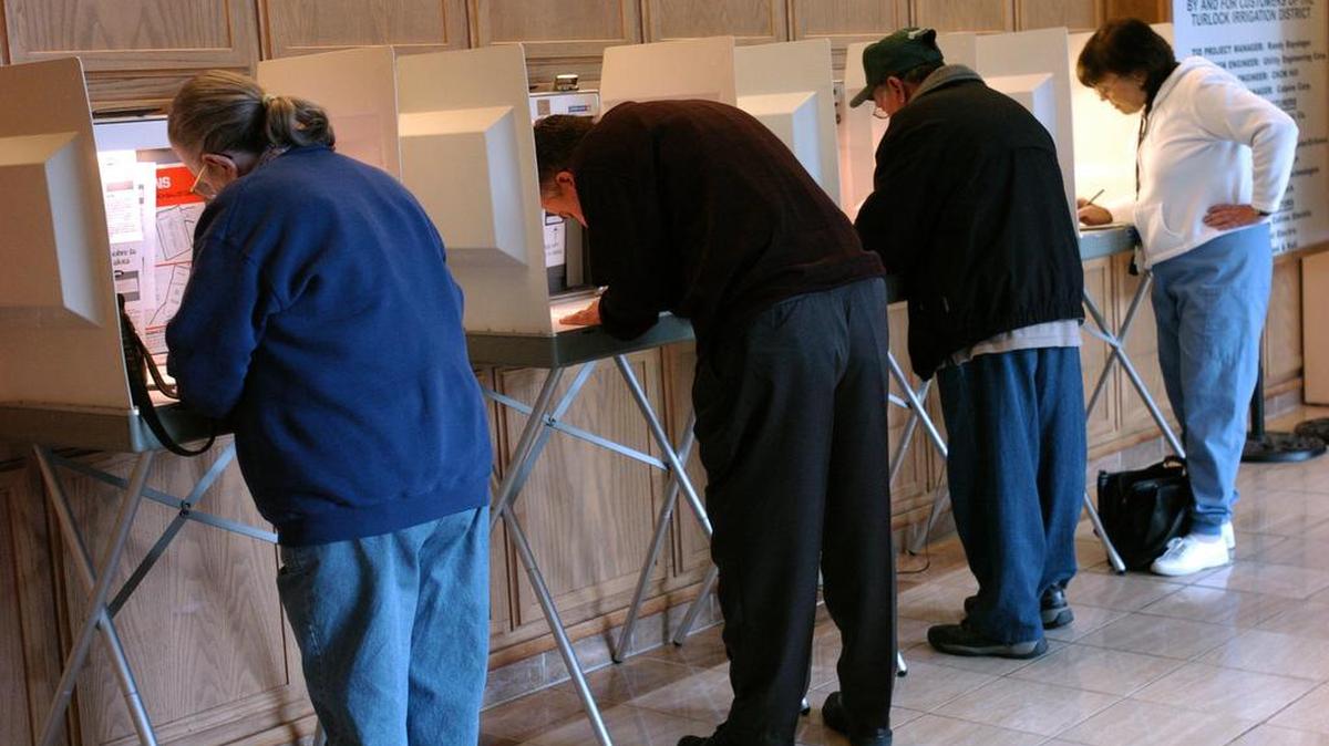 Voters fill four voting booths during an even-numbered year in November. Voting falls off precipitously in odd-numbered years.