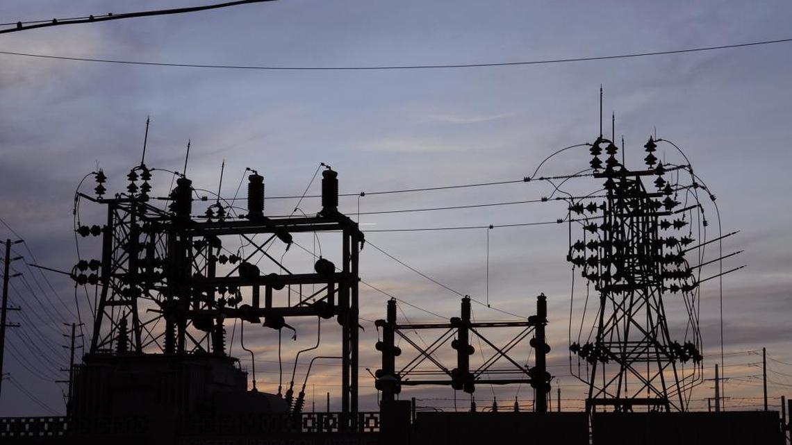 Silhouette of electrical lines at the Modesto Irrigation District Rosemore Station near Rosemore and Kansas avenues. MID charges more for electricity than utilities in neighboring areas.