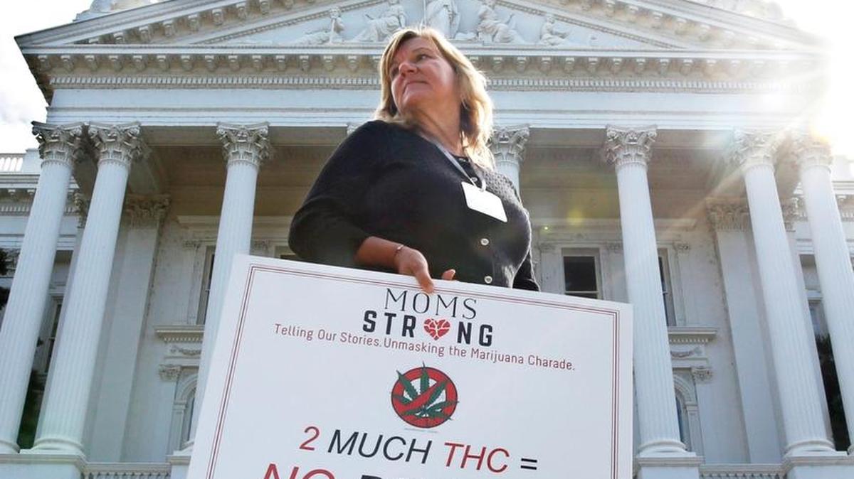 Carolyn Channing joins others at a rally against Proposition 64 at the Capitol in Sacramento on Oct. 4. If approved by California voters in November, Proposition 64 would legalize the recreational use of marijuana.