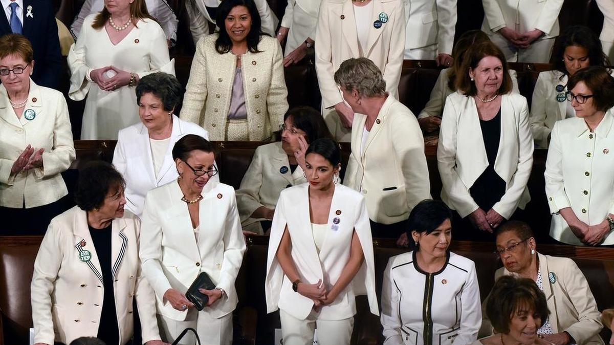 House Democratic women, including Rep. Alexandria Ocasio-Cortez (D-N.Y.), middle, are dressed in white for President Trump’s State of the Union address to a joint session of Congress on Tuesday.
