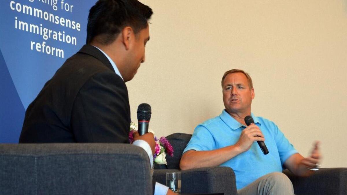 Rep. Jeff Denham, R-Turlock, right, speaks with Tony Evangelista in support of allowing some of the young people who were brought to the United States by their parents to remain under the so-called DREAM Act, established under President Obama.