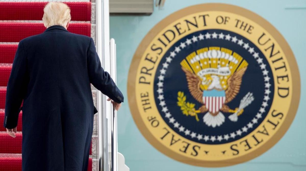 President Donald Trump walks up the steps of Air Force One on Friday as he prepares to fly to South Carolina for a rally at a Boeing factory, then on to his Mar-a-Lago estate in Palm Beach, Fla.