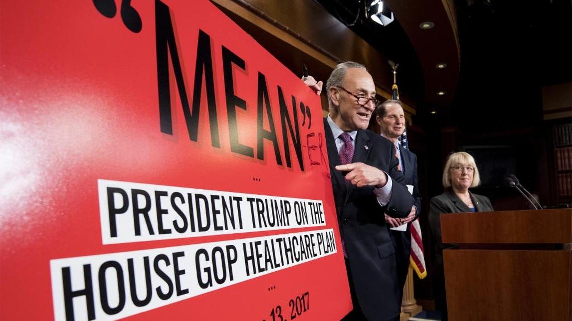 Senate Minority leader Chuck Schumer shows off his poster to explain what he thinks of the healthcare bill unveiled by his Republican colleagues.