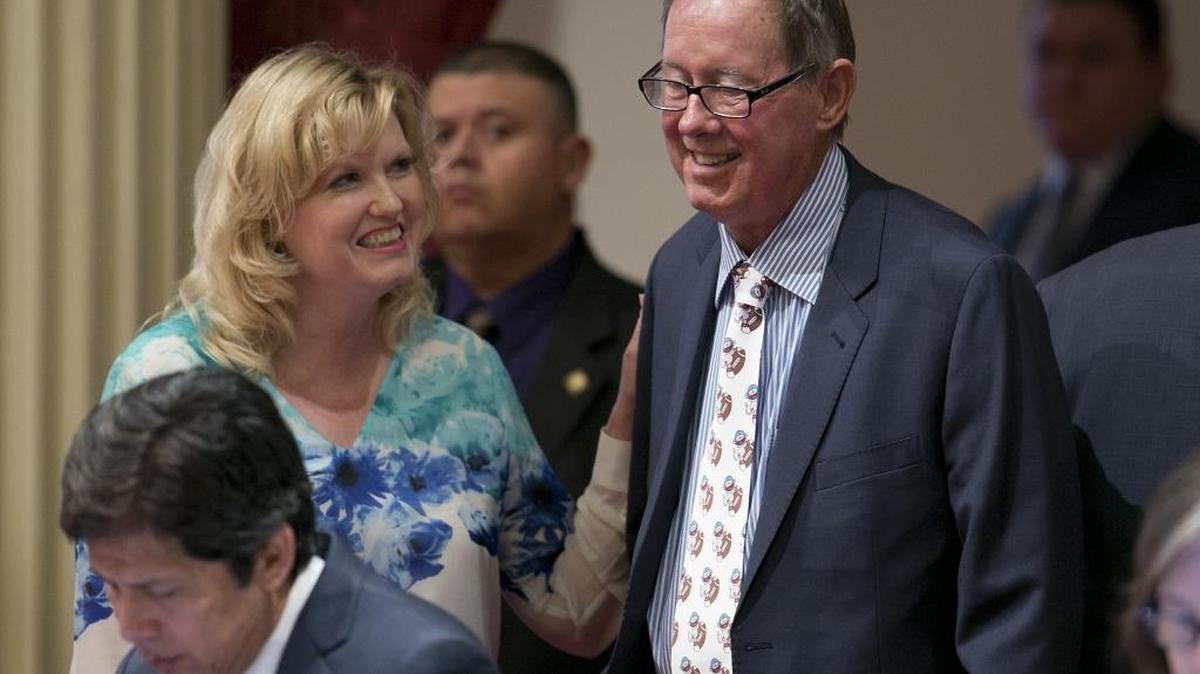 State Sen. Cathleen Galgiani, D-Stockton, left, smiles at Sen. Tom Berryhill, R-Twain Harte, after both voted to pass AB-398, one of the two climate change bills before the legislature.