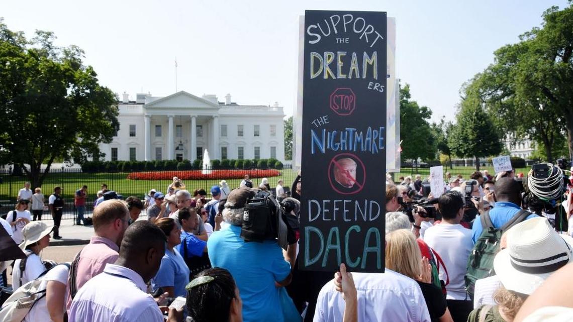 Protesters held signs supporting Deferred Action for Childhood Arrivals outside the White House last September.