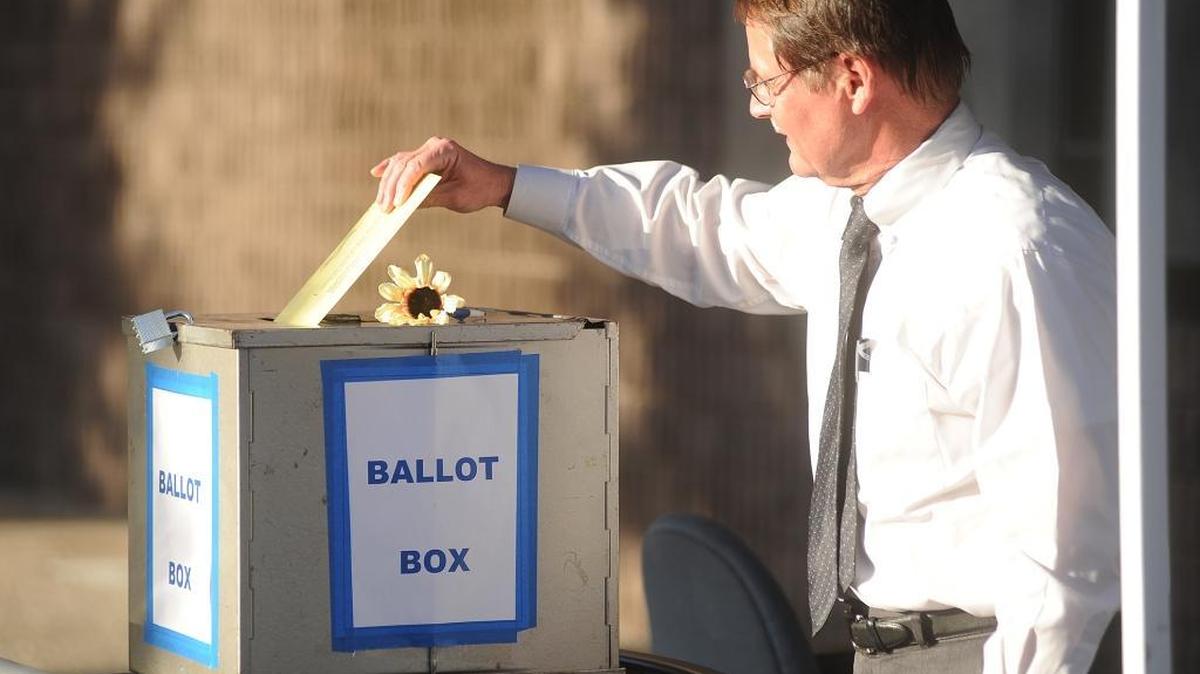 Modesto's Allen Mitterling drops his vote by mail ballot into the ballot box located outside the Stanislaus County Registrar of Voters' office in downtown Modesto in November 2013.
