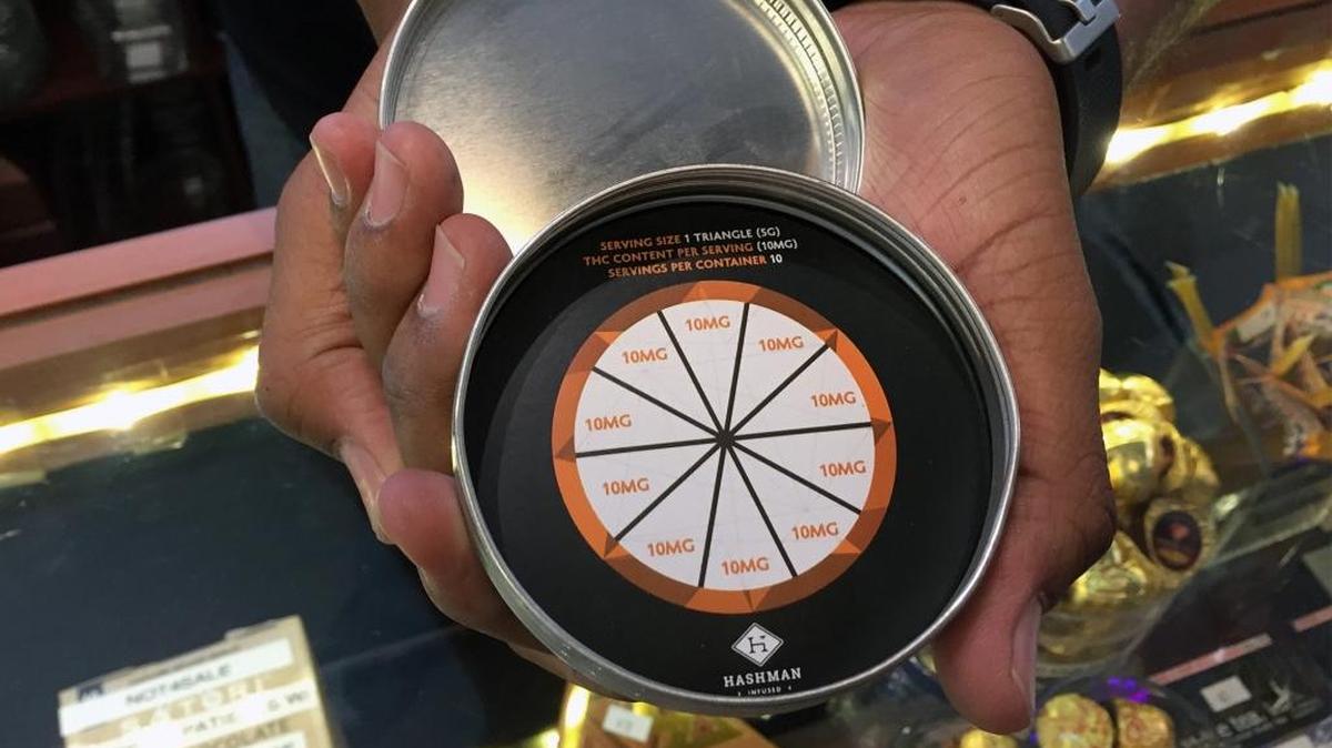A dosage chart is pictured at The People’s Remedy medicinal marijuana dispensary on Lone Palm Drive near Modesto. The products they carry are mainly edibles, some carrying distinct warnings about dosage.