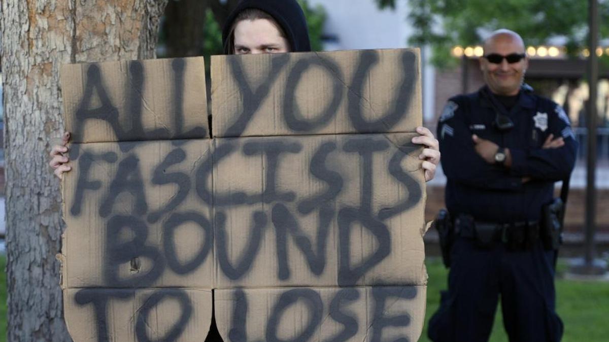 While a demonstrator peers over his sign during Ann Coulter’s speech to the Stanislaus, Merced and San Joaquin Republican central committees in April, a Modesto police officer appears bemused by the proceedings – which were largely peaceful. Some expected trouble during the event, but it never materialized perhaps due to a large (but smiling) police presence.