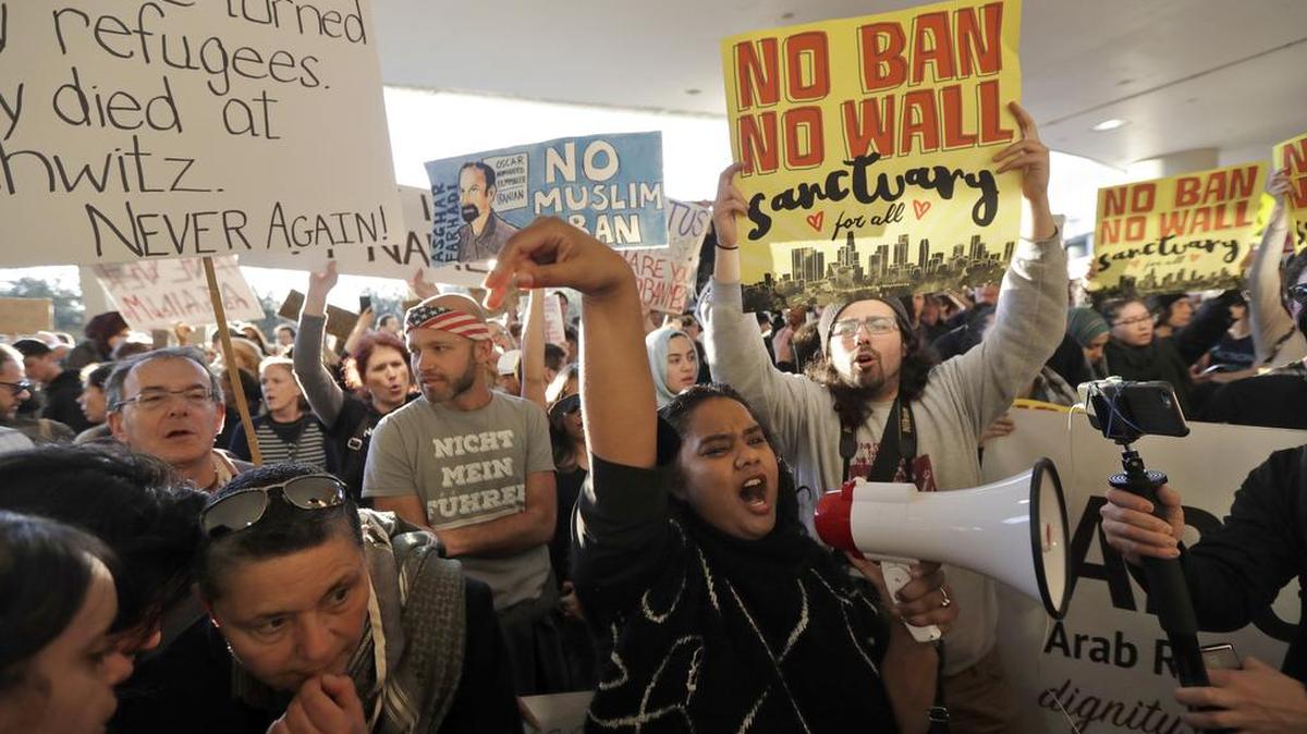 Protesters gather at San Francisco International Airport to denounce President Donald Trump’s executive order barring citizens of seven predominantly Muslim nations from entering the U.S.