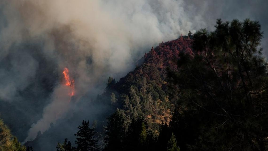 Spot fires ignite a hillside amid the Trailhead Fire in El Dorado and Placer counties on Tuesday, June 28, 2016. The blaze has charred more than 2,000 acres in a matter of days.