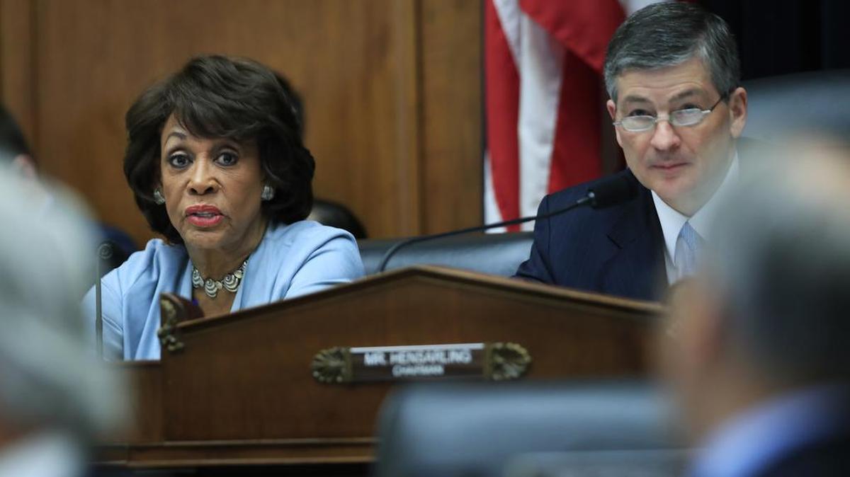 Rep. Maxine Waters D-Los Angeles, sits with with Rep. Jeb Hensarling of Texas on Capitol Hill in Washington.