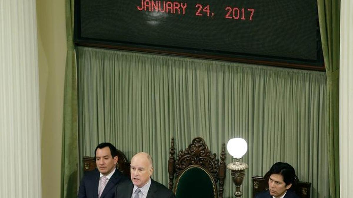 Gov. Jerry Brown delivers his annual State of the State address before a joint session of the California Legislature on Tuesday in Sacramento. Seated behind him are Assembly Speaker Anthony Rendon, D-Paramount, left, and Senate President Pro Tem Kevin de León, D-Los Angeles, right.