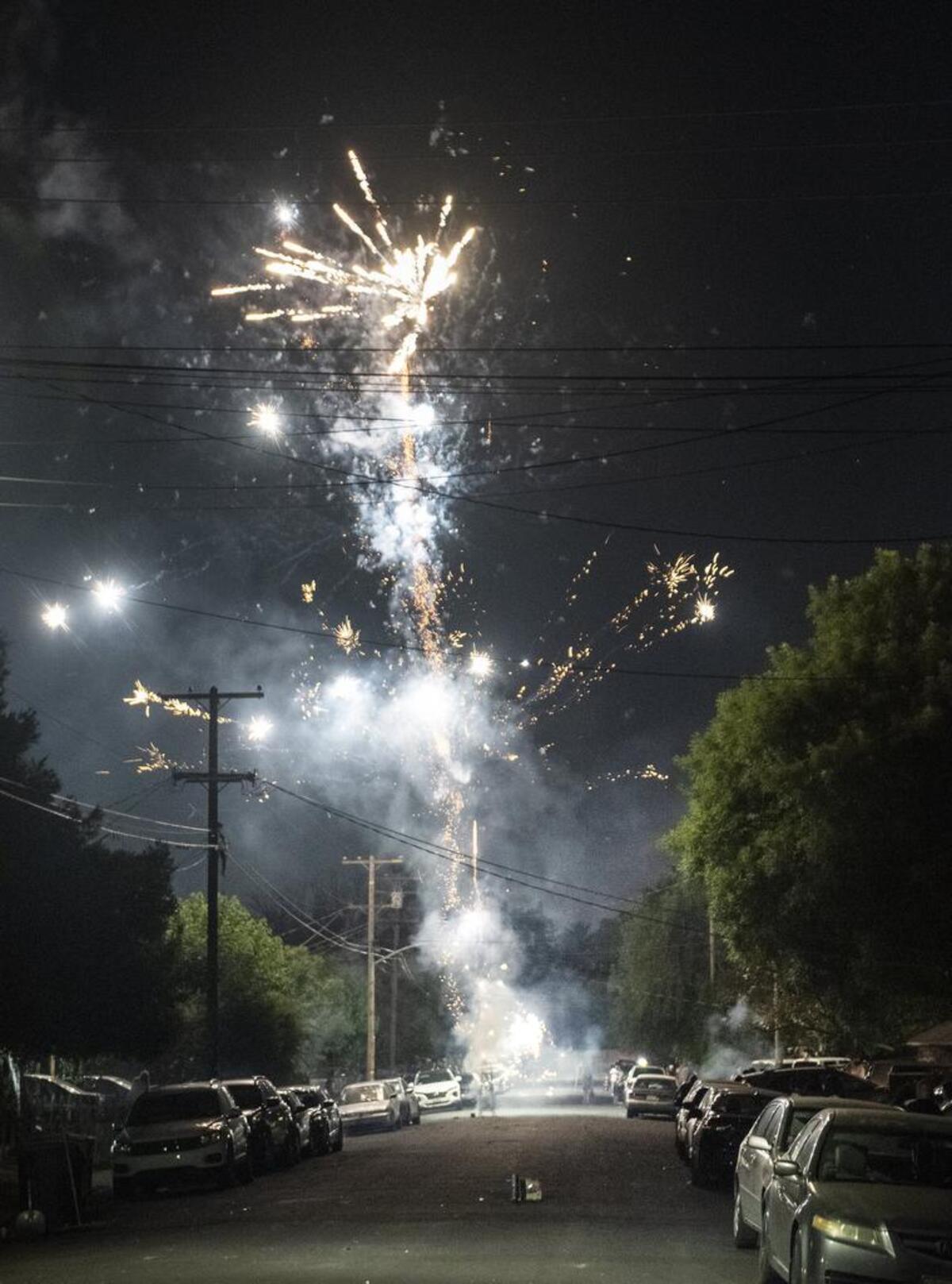 Illegal fireworks light up the street in Modesto Calif., Thursday, July 4, 2019.
