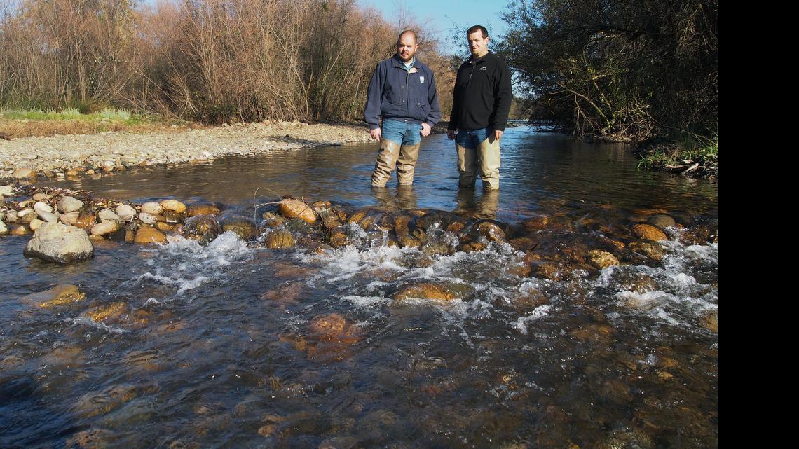 
John Davids of the Oakdale Irrigation District and Jason Guignard of FishBio, an Oakdale firm that does fisheries research and conservation projects, review a side channel off the main Stanislaus River where salmon spawn in 2012. The district reshaped gravel beds to help the fish spawn and improve their survival conditions. 
