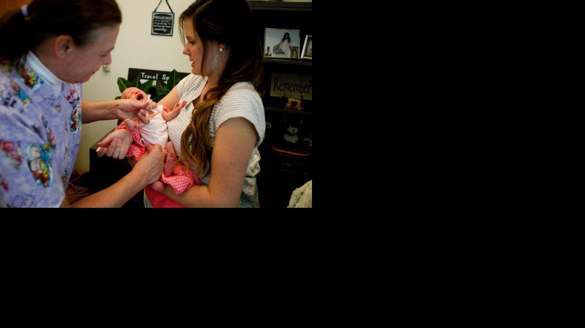 
A nurse administers a vaccine in Utah after a measles outbreak spread there from Disneyland. 
