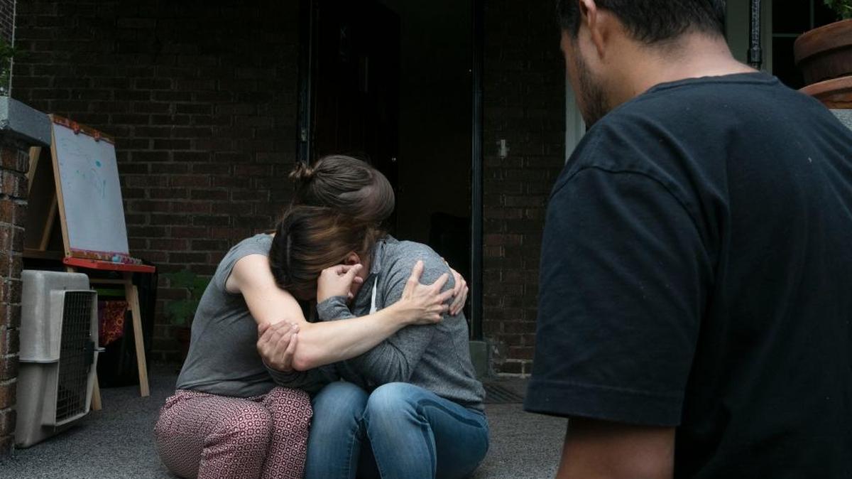 Sarah Menkedick, left, hugs Yeni González after talking to her about González’s children and her time in a detention center. González, a migrant mother separated from her children at the border, traveled across the country to join them in New York.