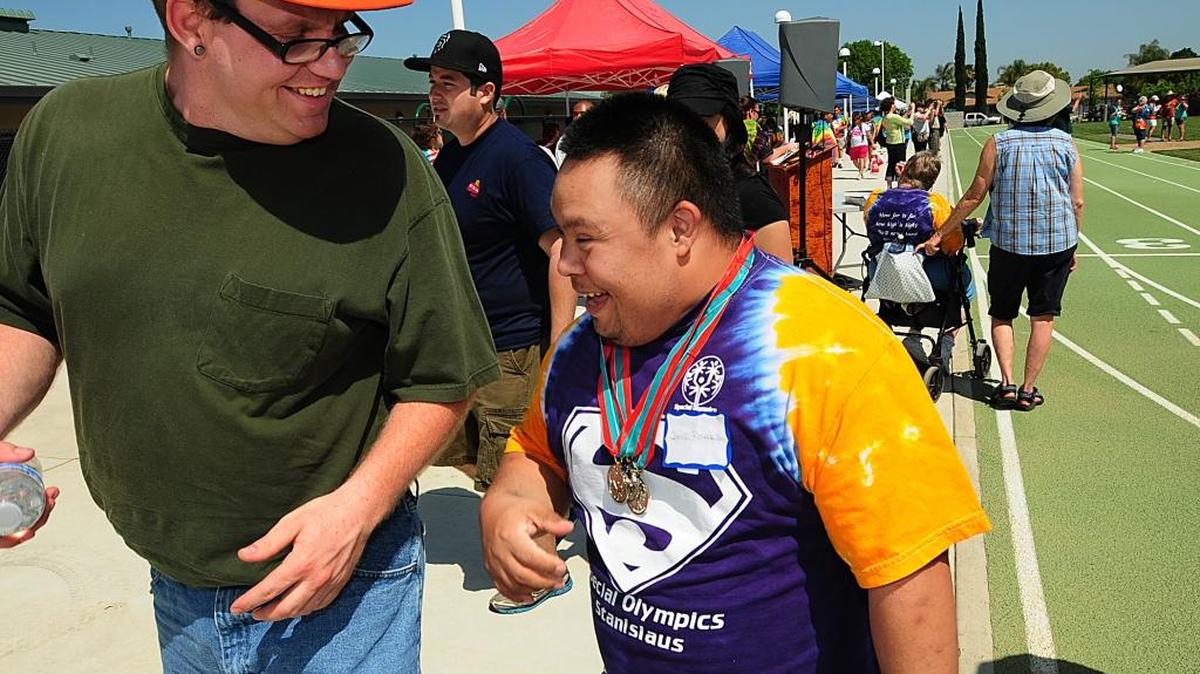 Julio Rosales is all smiles after medaling in three events during the Special Olympics Stanislaus County 40th Annual Track and Field Area Games in 2013.