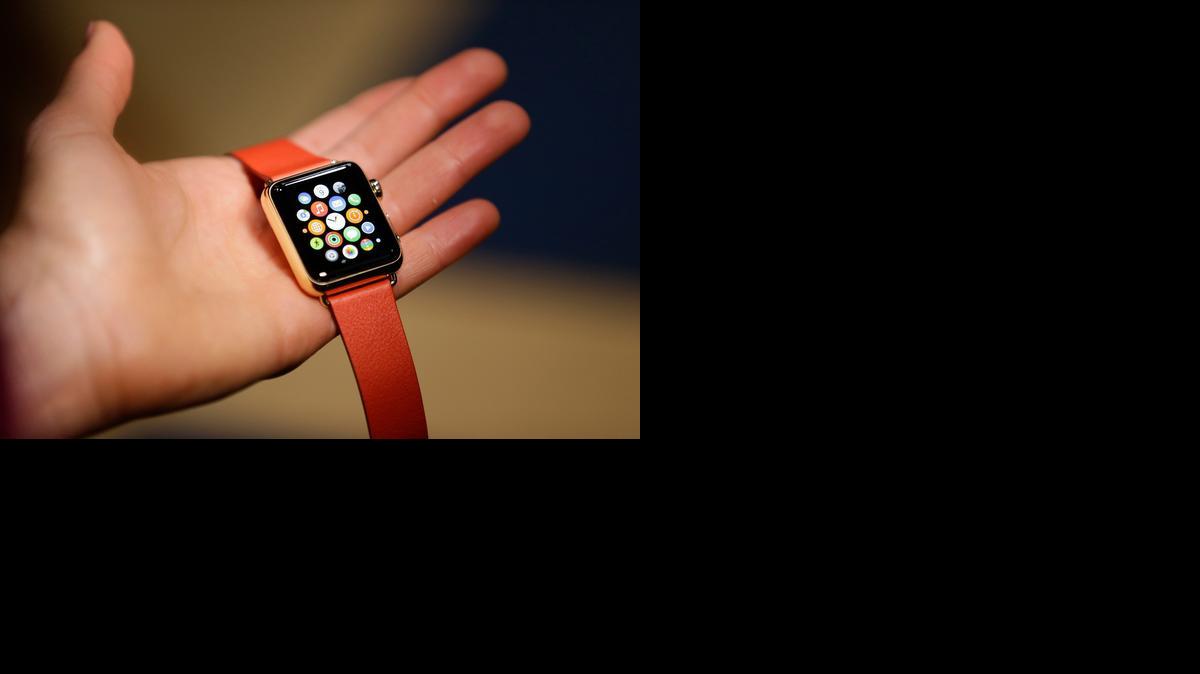 
A woman holds the Apple Watch  during a demo Monday in San Francisco. 
