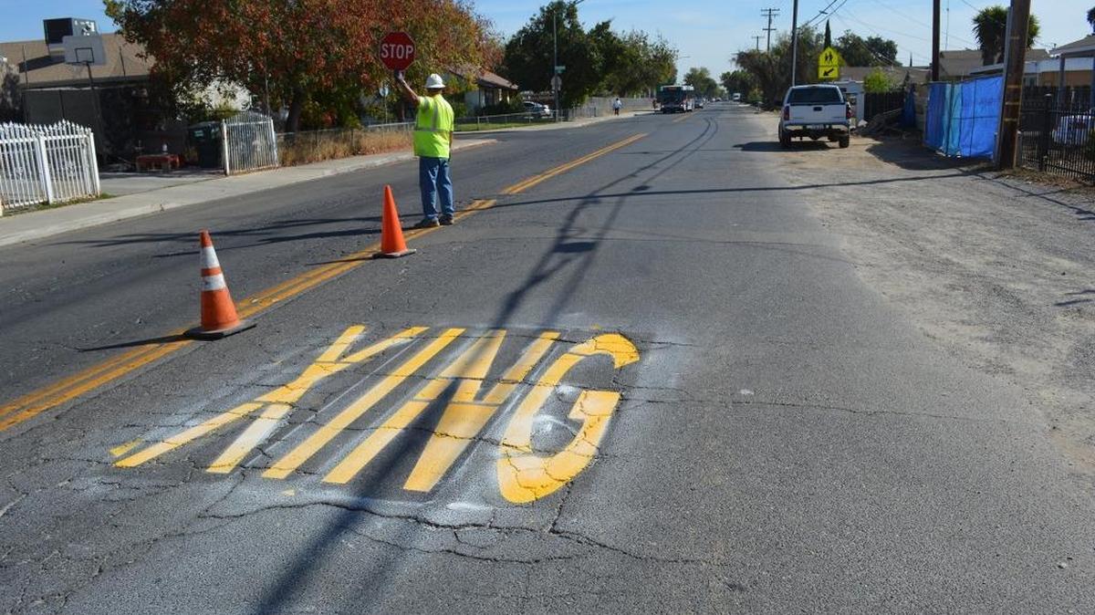 Stanislaus County Public Works employees sprayed a paint decal warning motorists that a pedestrian crossing looms Robertson Road School in west Modesto. But it doesn’t improve the pavement in an area where there are no sidewalks or curbs on one side, and in many cases, both sides of the streets. Measure L, a transportation sales tax on the November ballot, would give the county and its nine cities revenue to patch the streets, build new road and enhance public transportation.