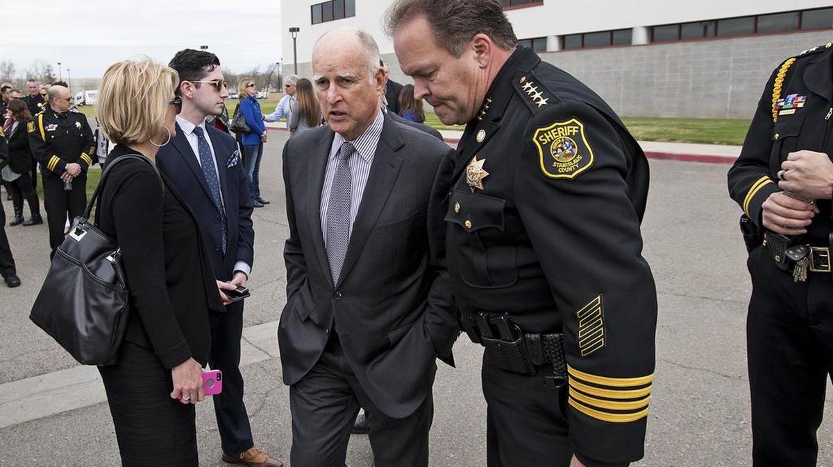 Sheriff Adam Christianson talks with California Governor Jerry Brown before the dedication ceremony of the Stanislaus County Sheriff’s Detention Center in 2017.