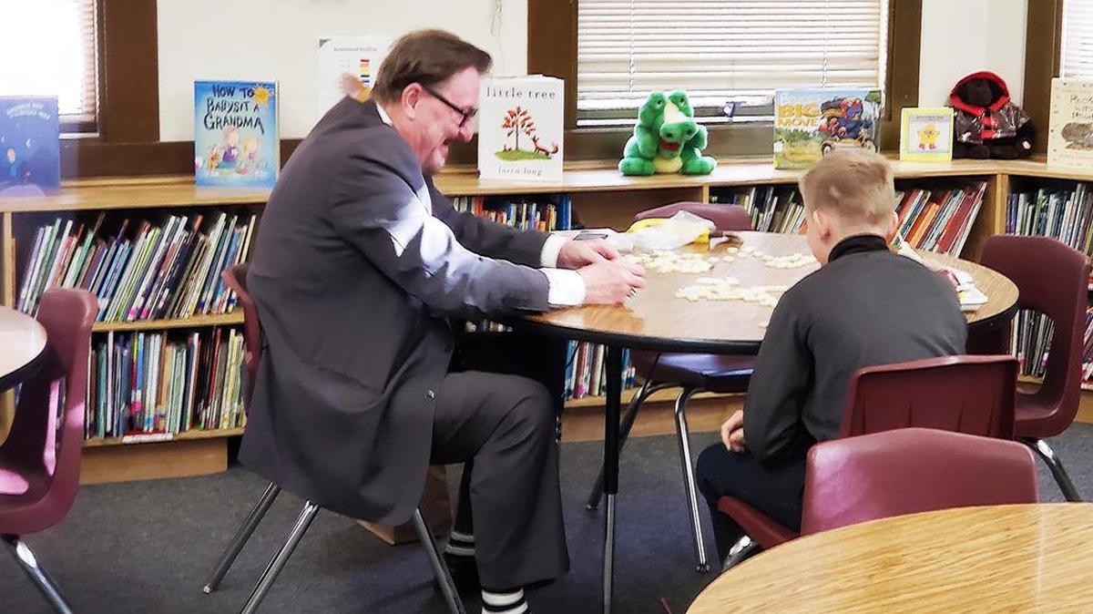 Keith Boggs, who works in the CEO’s office for Stanislaus County, helps one of his latest mentees with reading. The mentorship program has provided thousands of students across the county with regular, focused help from adult volunteers.