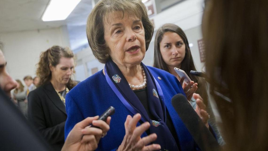 Sen. Dianne Feinstein, D-Calif., speaks with reporters on Capitol Hill in Washington in 2015. Feinstein proposed legislation to prohibit persons banned from flying on airlines from purchasing weapons.