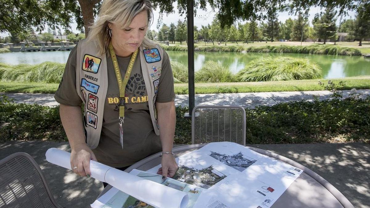 Camp Taylor executive director Kim Gamino lays out conceptual plans for the new camp facility at the site of the former county Honor Farm in 2015. This weekend, on Sept. 22, the camp will host the “Growing Hearts” event.