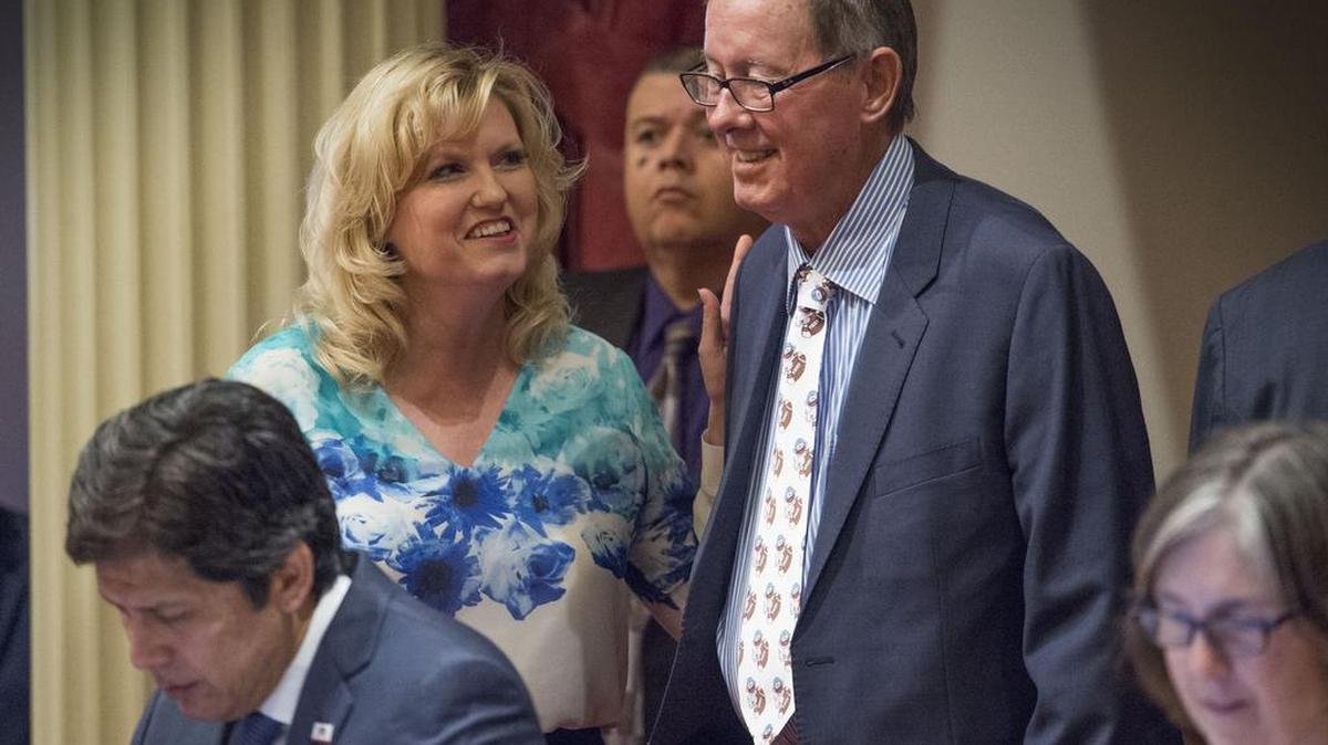 Sen. Tom Berryhill, right, is seen speaking to Sen. Cathleen Galgiani in July 2017. He missed every vote we checked in July and August and is said to be recovering from a broken hip.