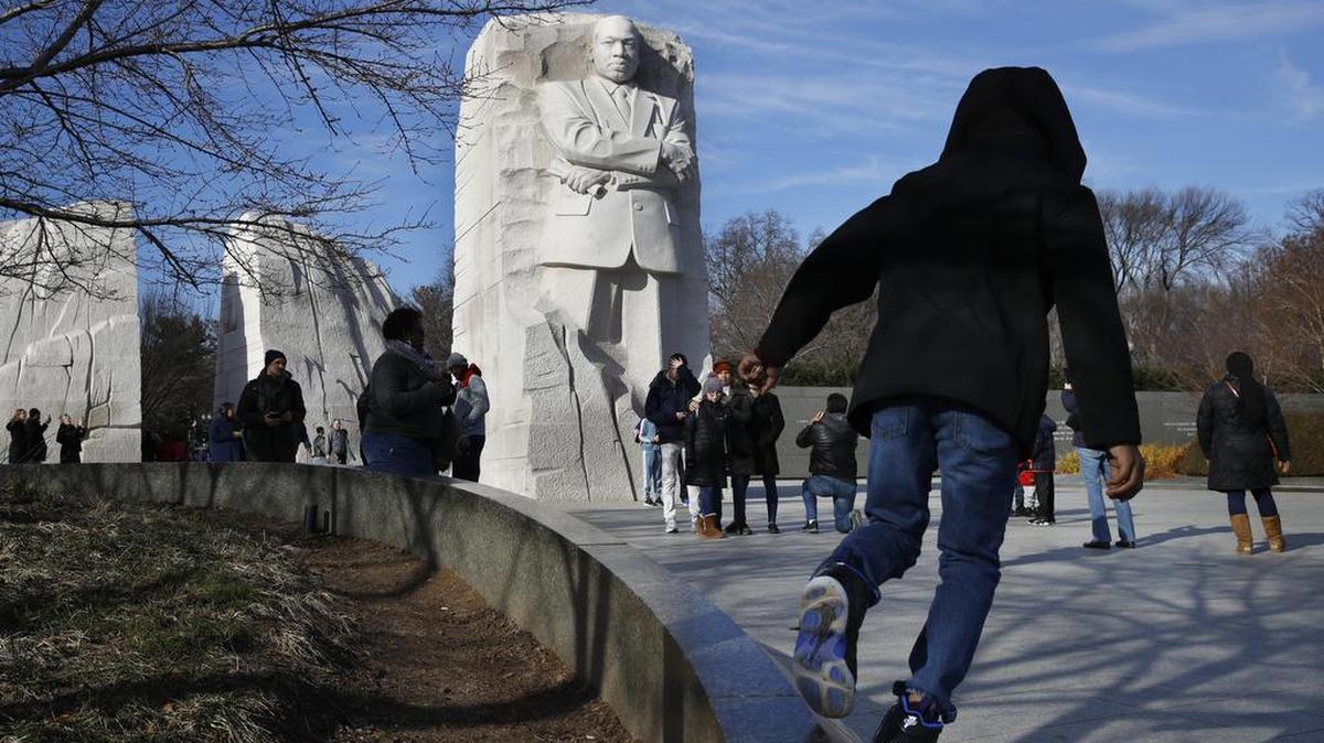 People visit the Martin Luther King Jr. Memorial in December, 2018, in Washington. King’s birth is celebrated on January 21 this year.