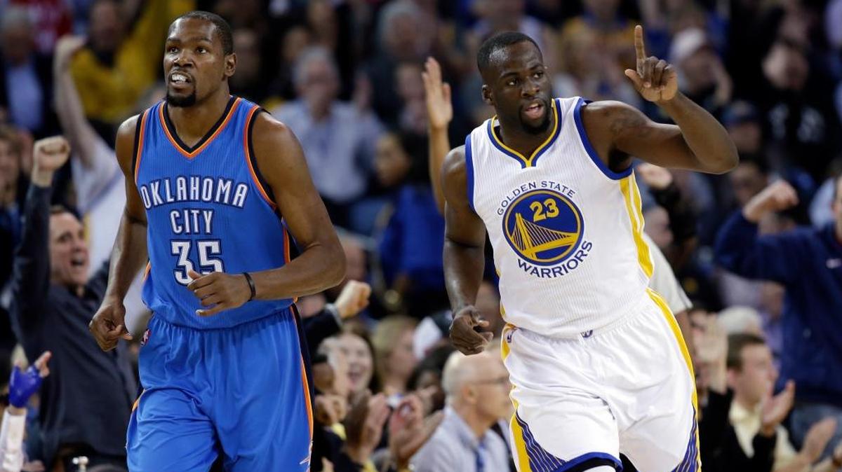 The Warriors’ Draymond Green (23) celebrates after scoring next to the Thunder’s Kevin Durant during the first half of an NBA basketball game on March 3, 2016, in Oakland.