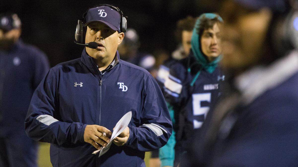 Downey High head coach Jeremy Plaa works the sidelines during against Modesto at Downey High on Friday, Oct. 20, 2017.