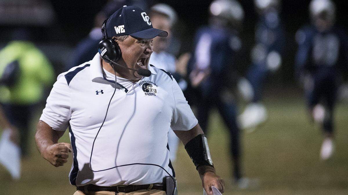 Central Catholic coach Roger Canepa celebrates a touchdown during the Valley Oak League game with Oakdale at Central Catholic High School in Modesto, Calif., on Friday, Nov. 3, 2017.
