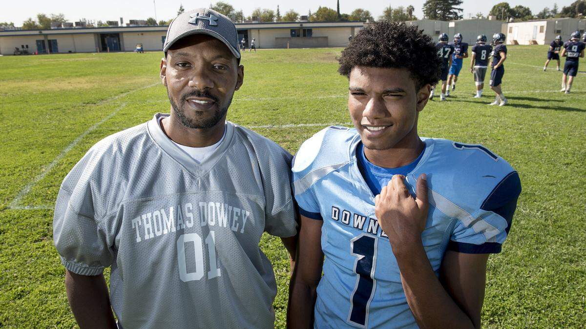 Jairol Red, left, and his son Jairol Harris-Red at Downey High School in Modesto, Calif., on Thursday Oct. 12, 2017. Red was diagnosed with cancer, since then, sports have become the place where both father and son can go to be free of worry and emotion.