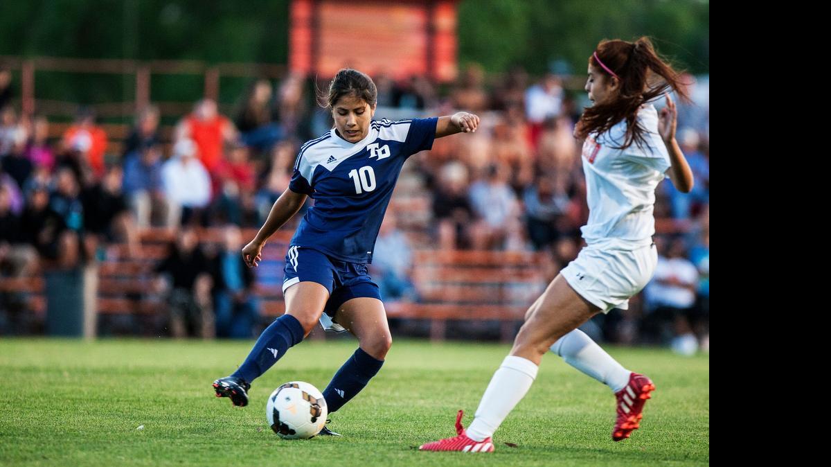 Downey’s Pricilla Cardenas controls the ball against Merced on Tuesday. The Knights beat the Bears 1-0.
