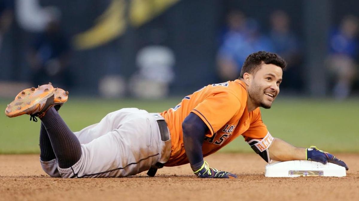 Houston star Jose Altuve has a laugh after tripping near second base on Saturday in a 15-3 win over the Royals in Kansas City, Mo.