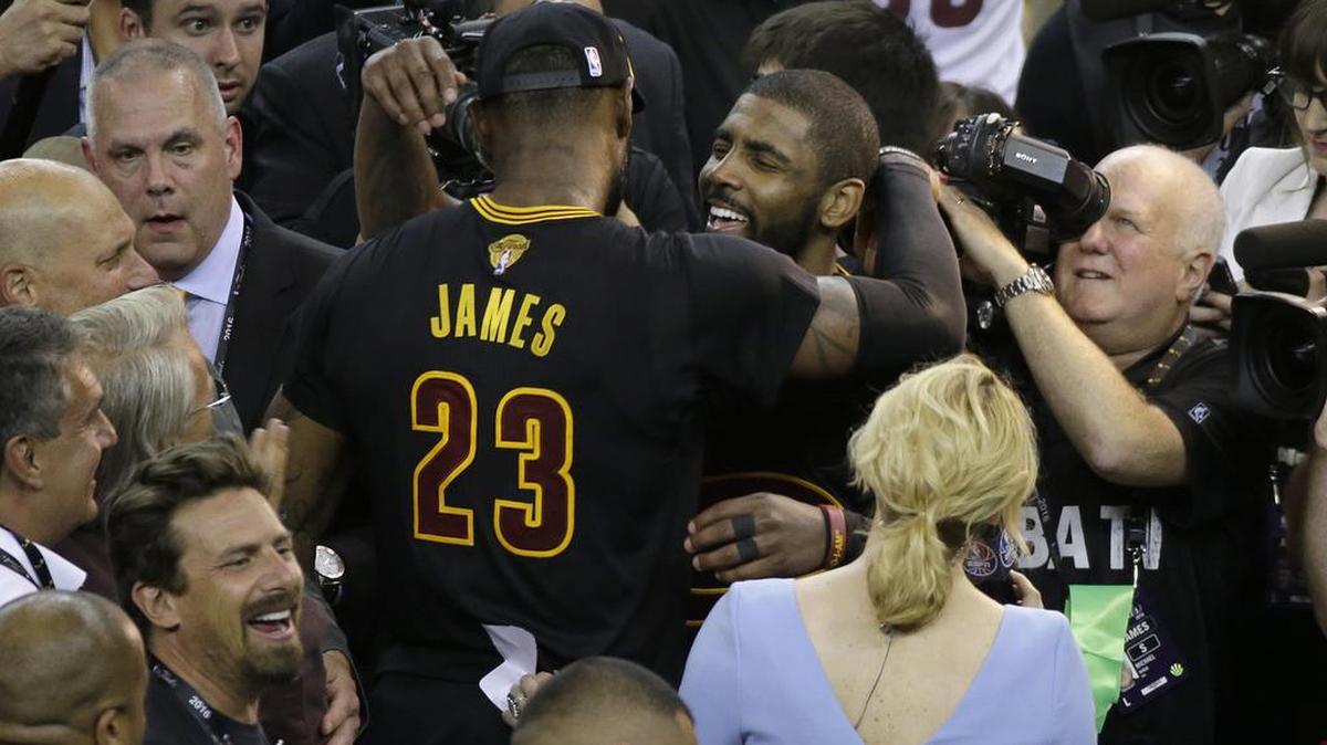 Cleveland’s LeBron James embraces teammate Kyrie Irving in celebration of the Cavs’ 93-89 victory over the Golden State Warriors in Game 7 of the NBA Finals. James made good on his promise, to bring a Sports Championship back to the town of Cleveland, Ohio for the first time in 52 years.