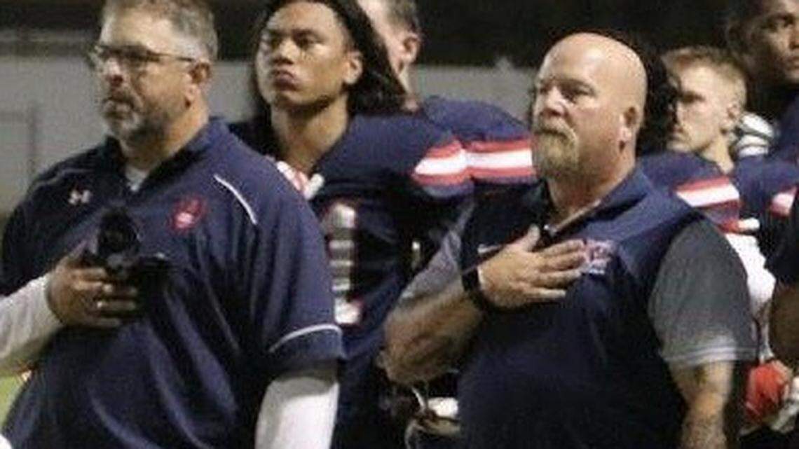 Jeff Martin (right) was an assistant coach with the Modesto Christian High football team. Martin died Saturday, March 10, at the age of 47. Here, Martin is pictured alongside Crusader football coach Mike Parsons.