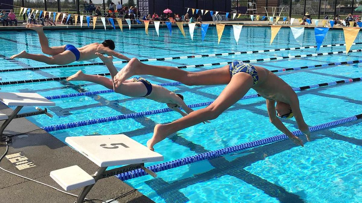 Swimmers plunge into the pool during the 23rd annual Northern California Relays held Saturday at Johansen High’s B. Brent Bohlender Aquatics Facility.
