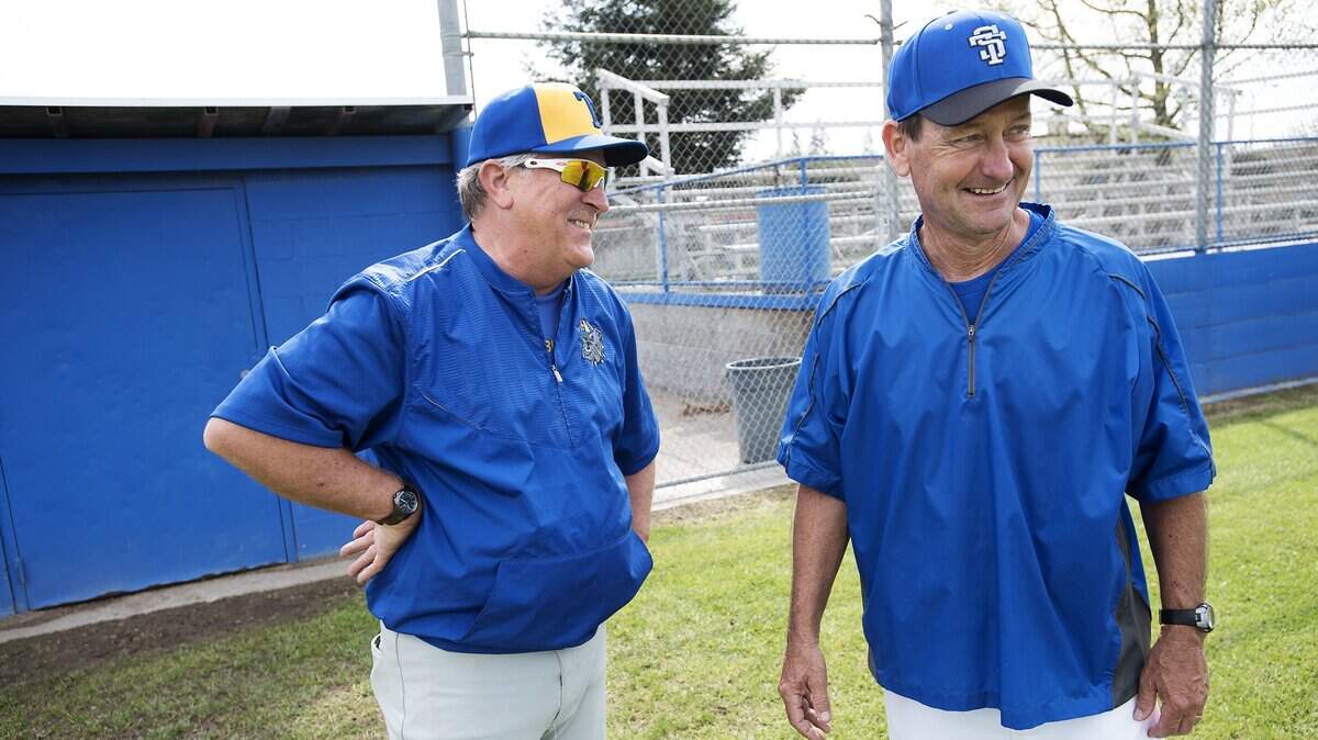 Turlock coach Mark de la Motte, left, and Sierra's Jack Thomson, right, chat before the game at Sierra High School in Manteca, Calif., on Wednesday, March, 15, 2017.