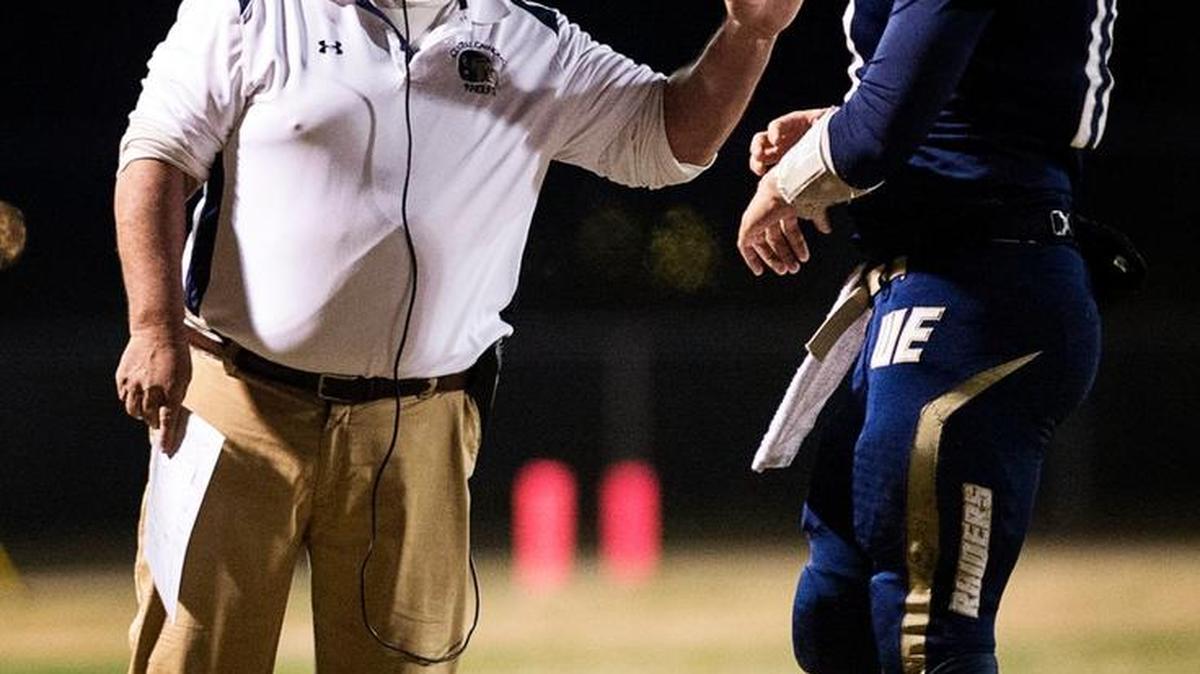 Central Catholic coach Roger Canepa, quarterback Hunter Petlansky and the rest of the Central Catholic Raiders find themselves in Cal-Hi Sports’ Top 25 for the first time in school history. They are pictured during the CIF Northern California regional final game with Marin Catholic at Central Catholic High School in Modesto, Calif., on Saturday, Dec. 12, 2015.