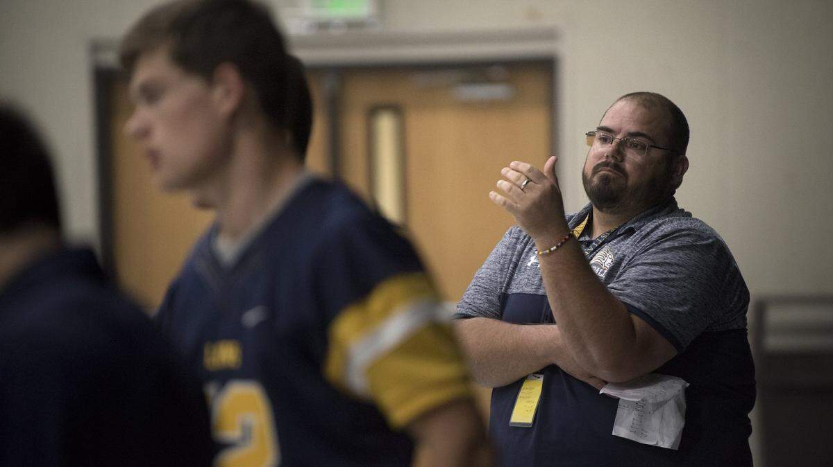 Big Valley head coach Brian Berkefeld directs the pregame walkthrough Football team at Big Valley Christian High School in Modesto, Calif., on Friday, Oct. 20, 2017.