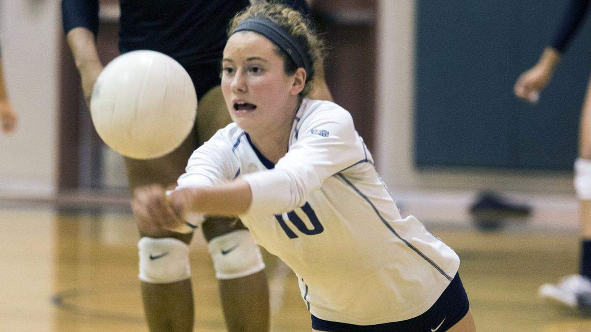 Julia Handy (10) of Turlock High dives for a dig during a match against Pitman in 2016.