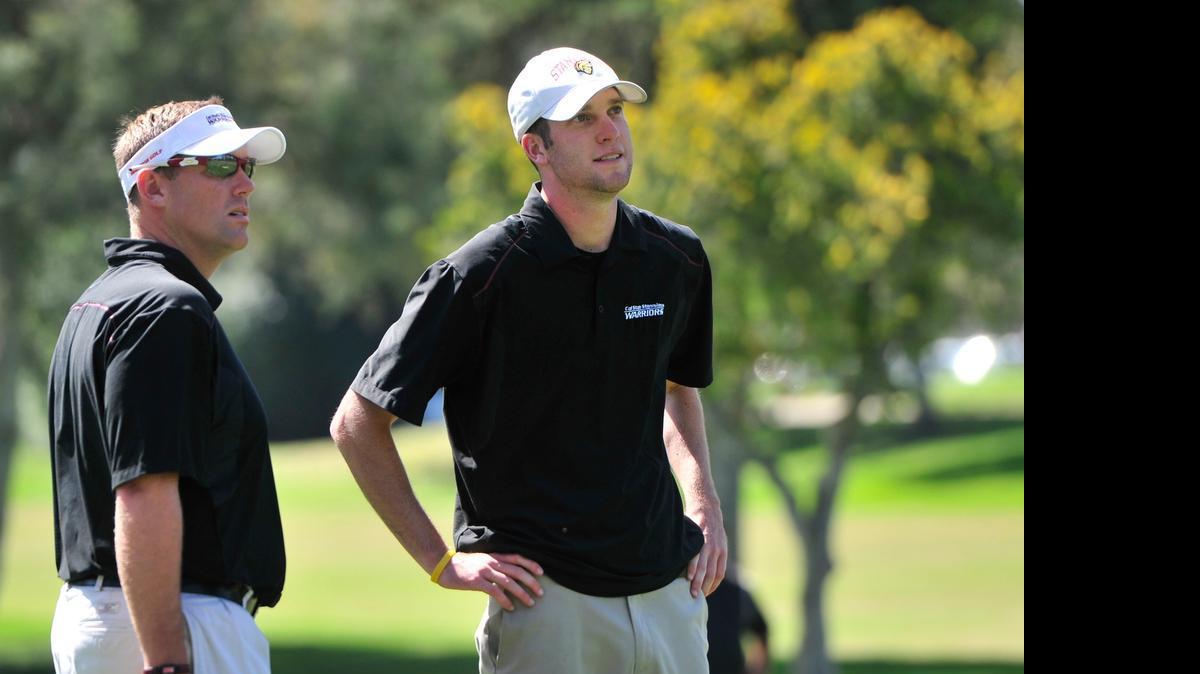 
Cal State Stanislaus head coach John Cook, left, with Stanislaus golfer Trevor Blair in 2012. Cook was named on Tuesday as the new coach at the University of the Pacific in Stockton.
