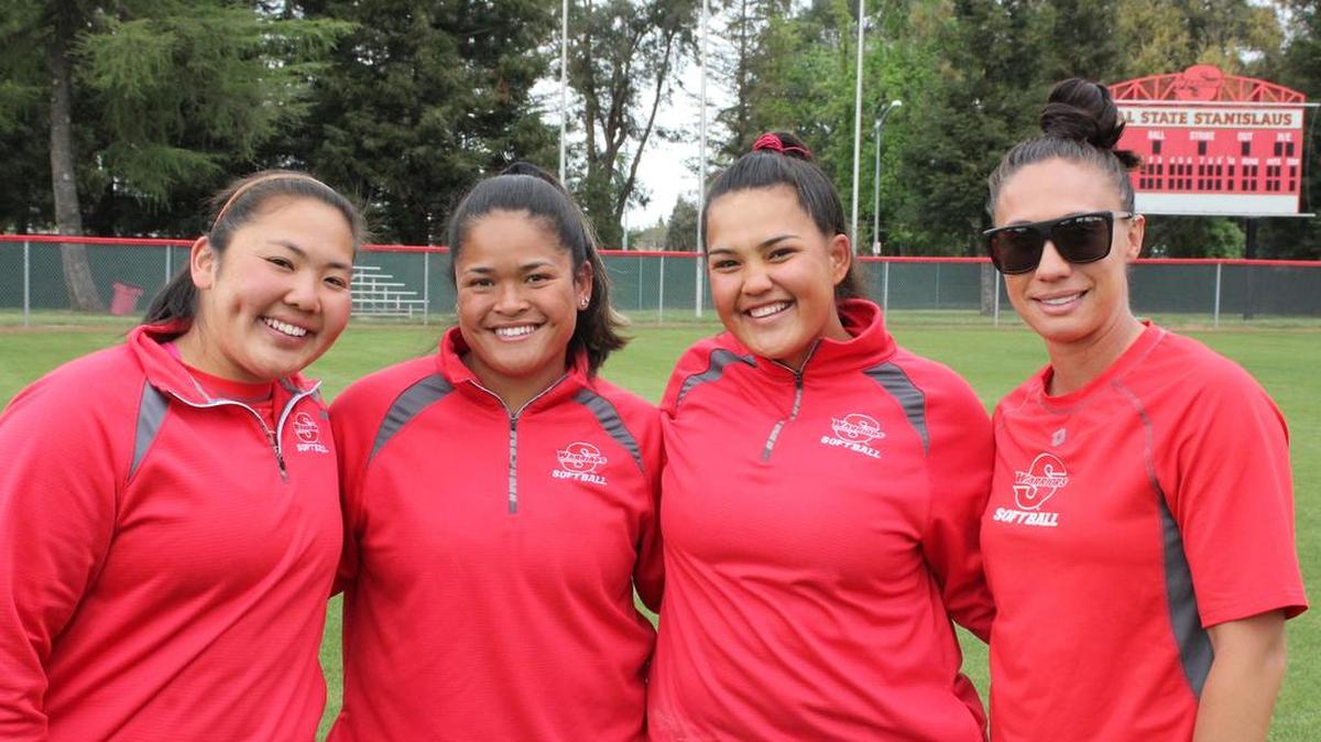Stanislaus State softball players, from left, Maya Yoshiura, Lia Tom and Joerdan Lovell, along with coach, Jessica Ventoza.