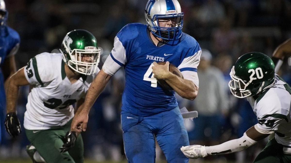 
Modesto quarterback Trey Cooper scrambles for a gainer during the game with Diablo Valley College in Modesto, Calif., on Saturday, Sept. 19, 2015.
