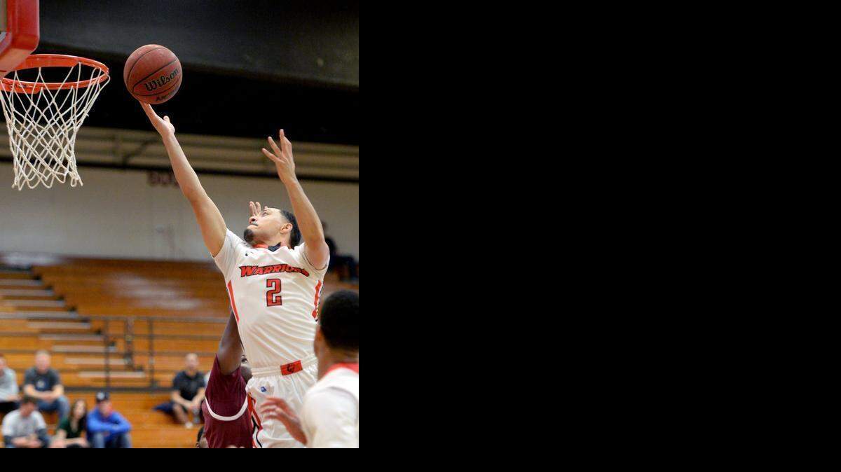 
CSU Stanislaus guard Shey Mataele releases the ball at the rim on a lay-up during a game between CSU Stanislaus and CSU Dominguez Hills in Turlock at CSU Stanislaus on January 30th, 2015.
