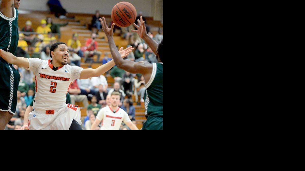 
Stan State guard Shey Mataele reaches out for a lose ball during a game between Stanislaus State and Humboldt State in Turlock on January 10th.
