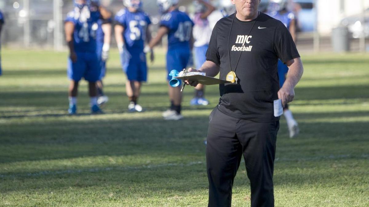 
Head Coach Rusty Stivers looks around during the first padded practice for the 2015 MJC football team at Modesto Junior College on Aug 13, 2015. The Pirates kick off the 2015 season Saturday, Sept. 5, at MJC Stadium against American River College.
